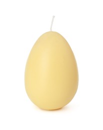 Photo of Yellow egg-shaped candle isolated on white. Easter decor