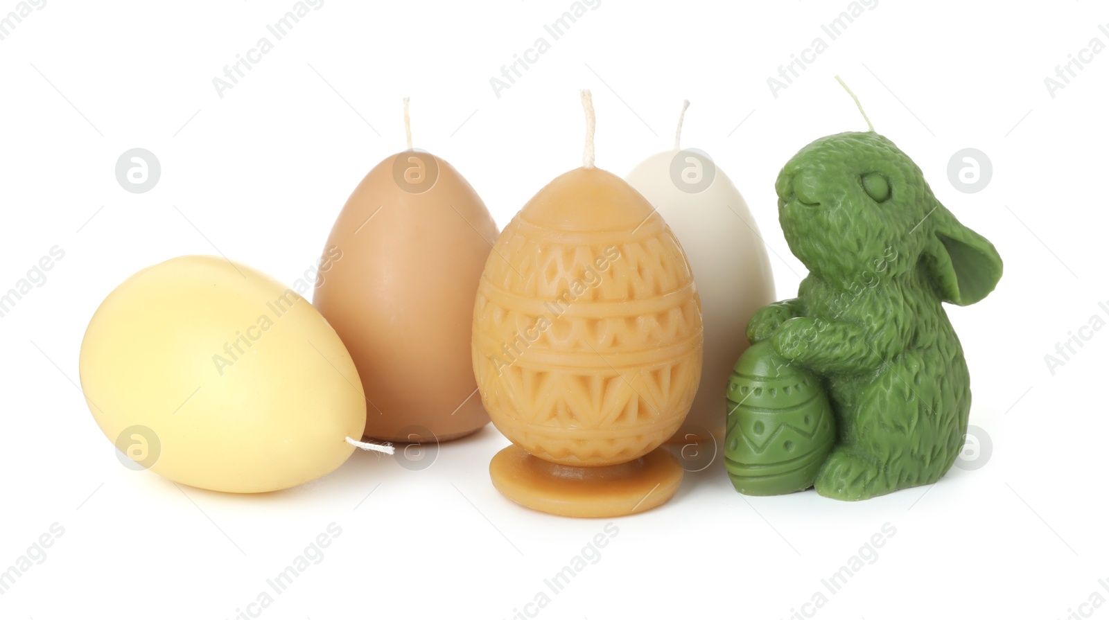 Photo of Bunny and egg shaped candles isolated on white. Easter decor