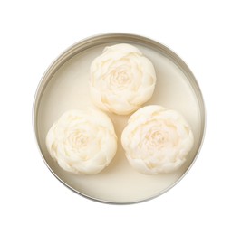 Photo of Beautiful flower-shaped candles in jar isolated on white, top view