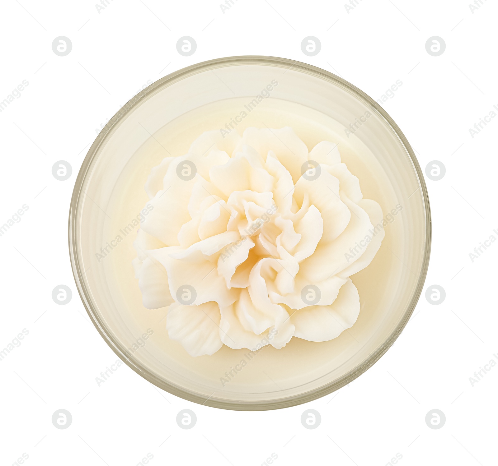 Photo of Beautiful flower-shaped candle isolated on white, top view