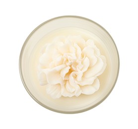 Photo of Beautiful flower-shaped candle isolated on white, top view