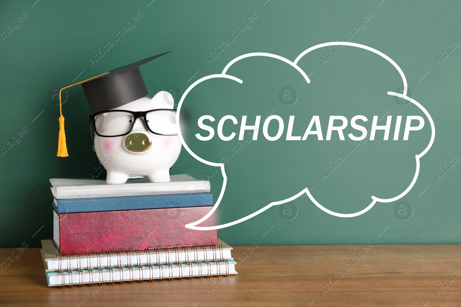 Image of Scholarship. Piggy bank with graduate hat, eyeglasses and books on table near green chalkboard. Speech cloud with word