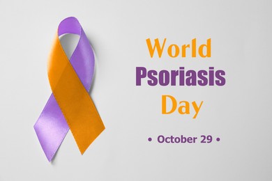 Image of World Psoriasis Day (October, 29). Orange-orchid awareness ribbon on white background, top view