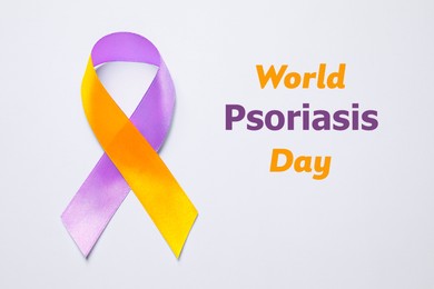 Image of World Psoriasis Day. Orange-orchid awareness ribbon on white background, top view