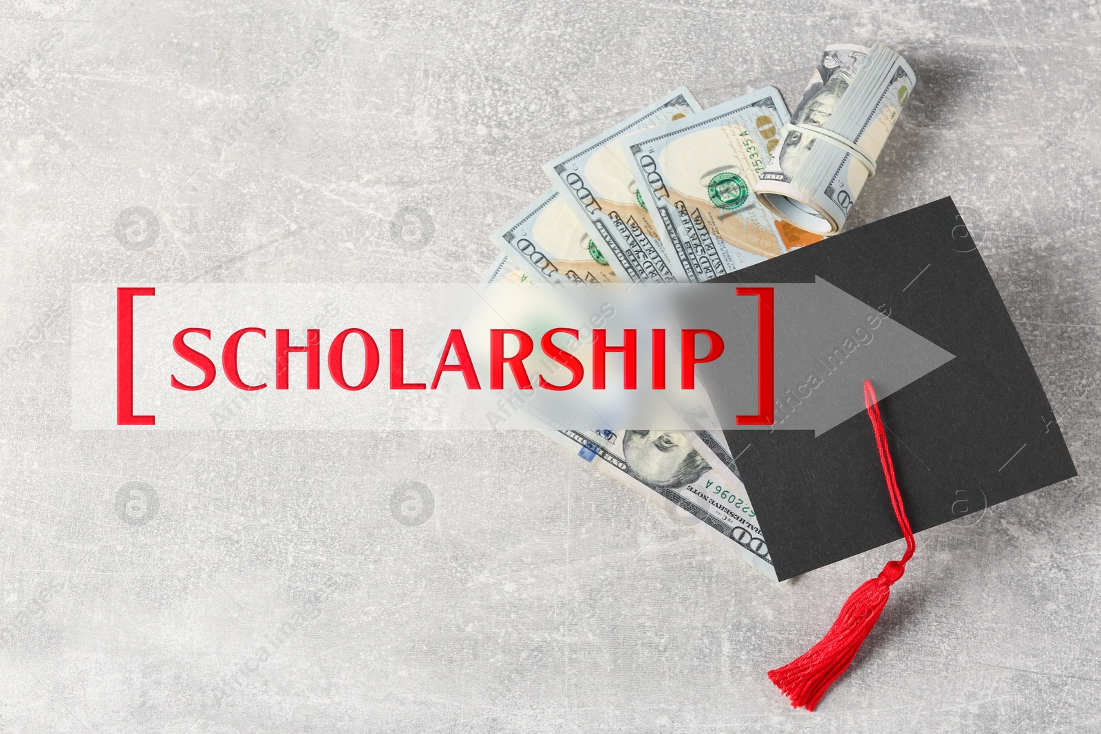 Image of Scholarship. Graduate hat and dollar banknotes on light grey table