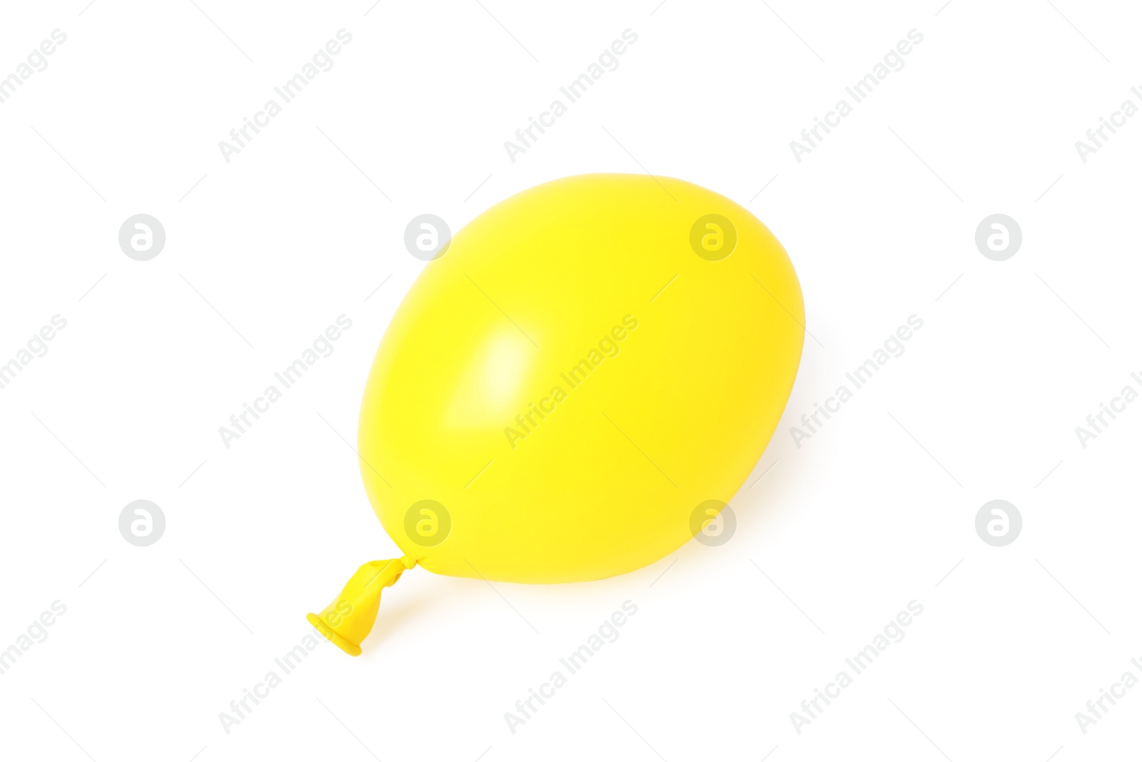 Photo of One yellow half deflated balloon isolated on white