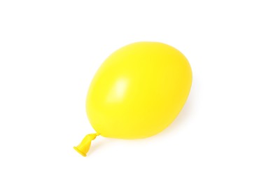 Photo of One yellow half deflated balloon isolated on white