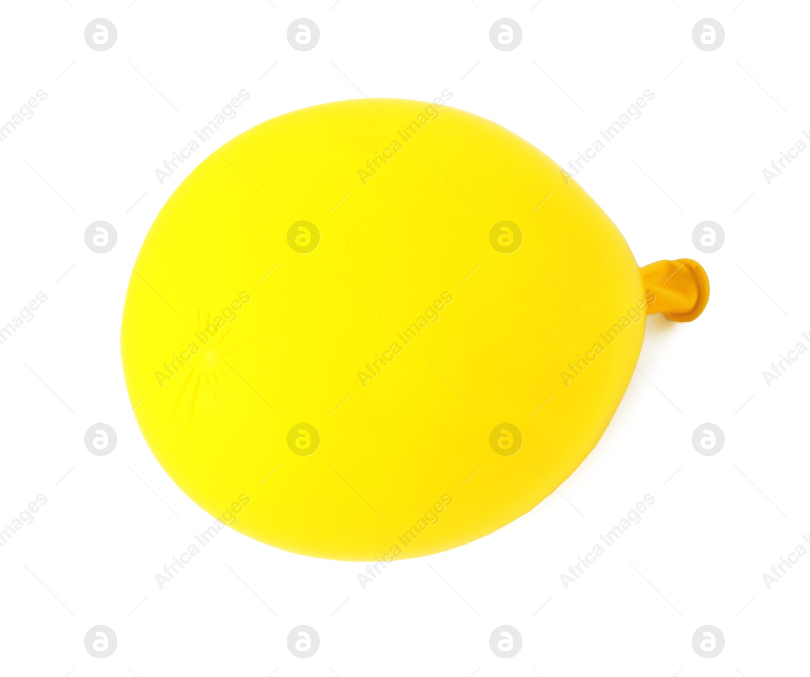 Photo of One yellow half deflated balloon isolated on white