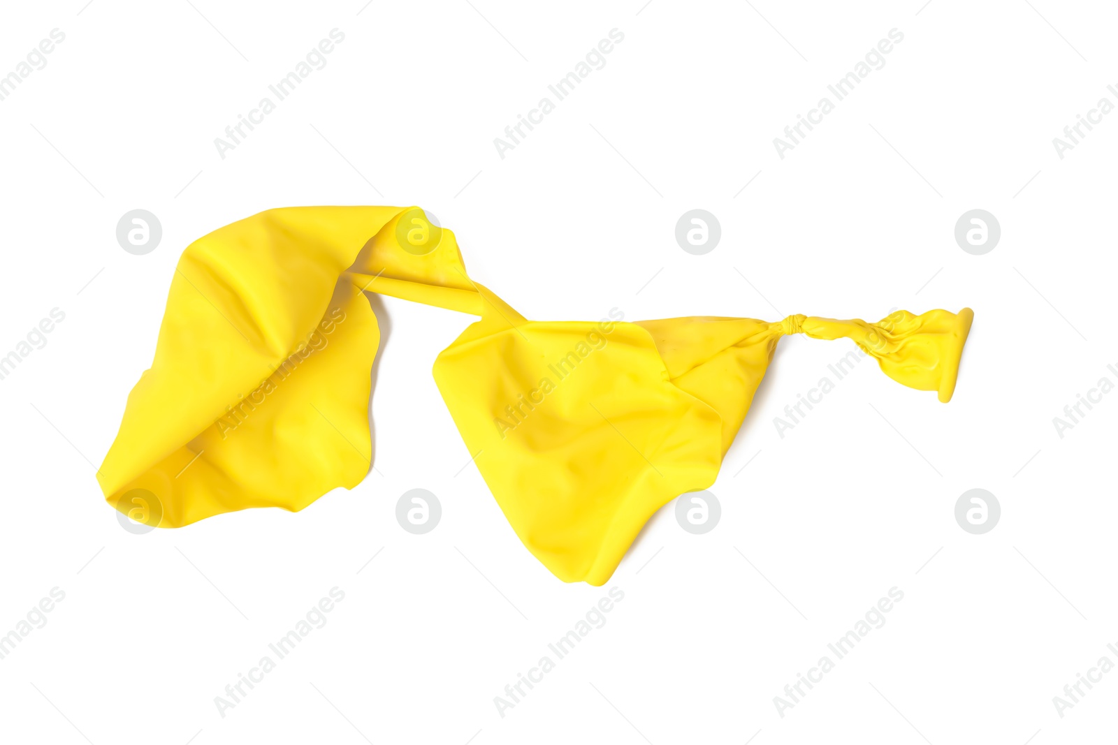 Photo of One yellow popped balloon isolated on white