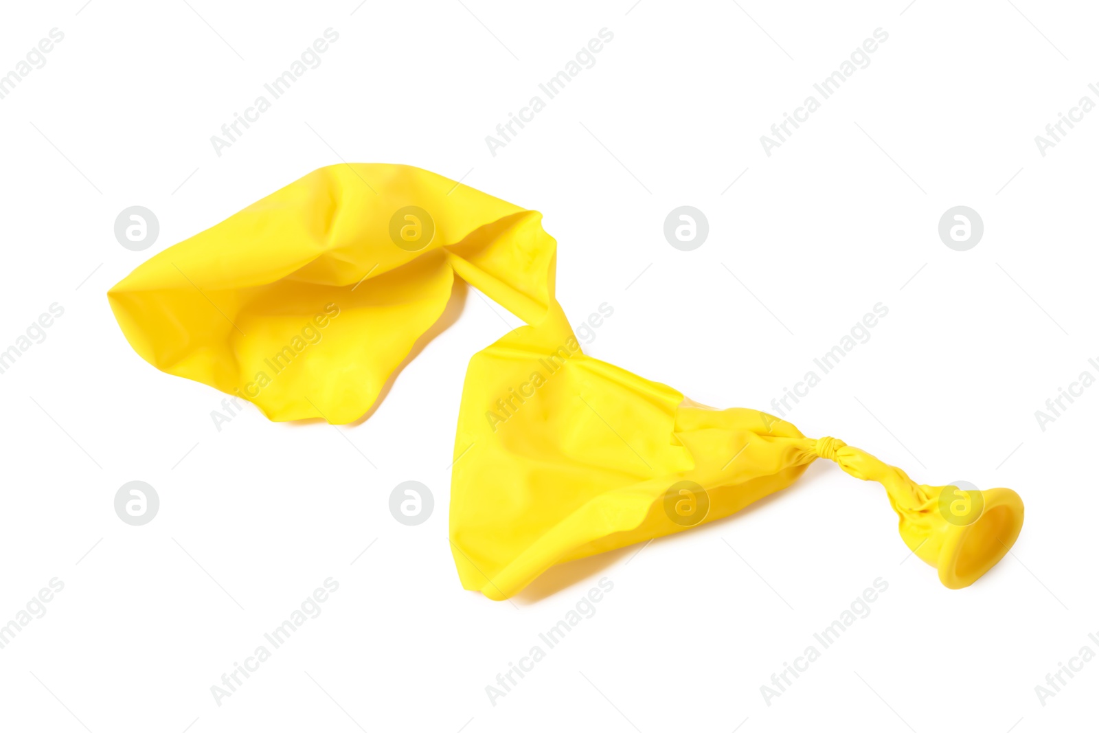 Photo of One yellow popped balloon isolated on white