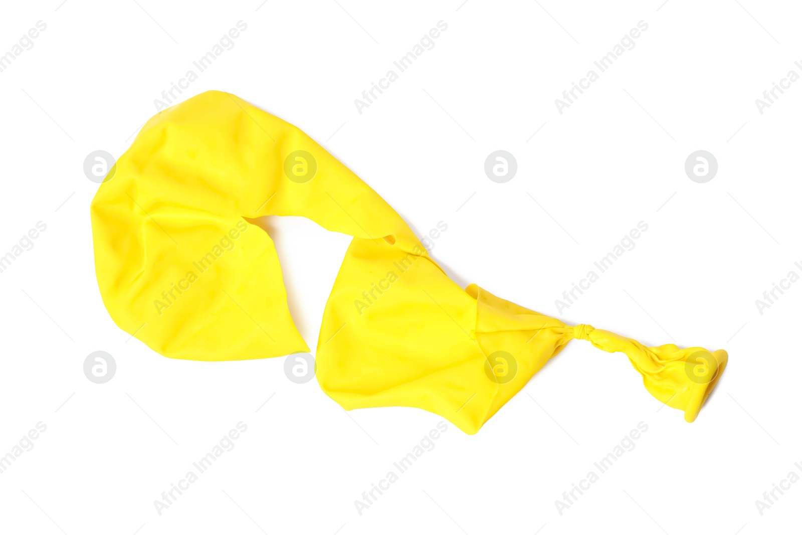 Photo of One yellow popped balloon isolated on white