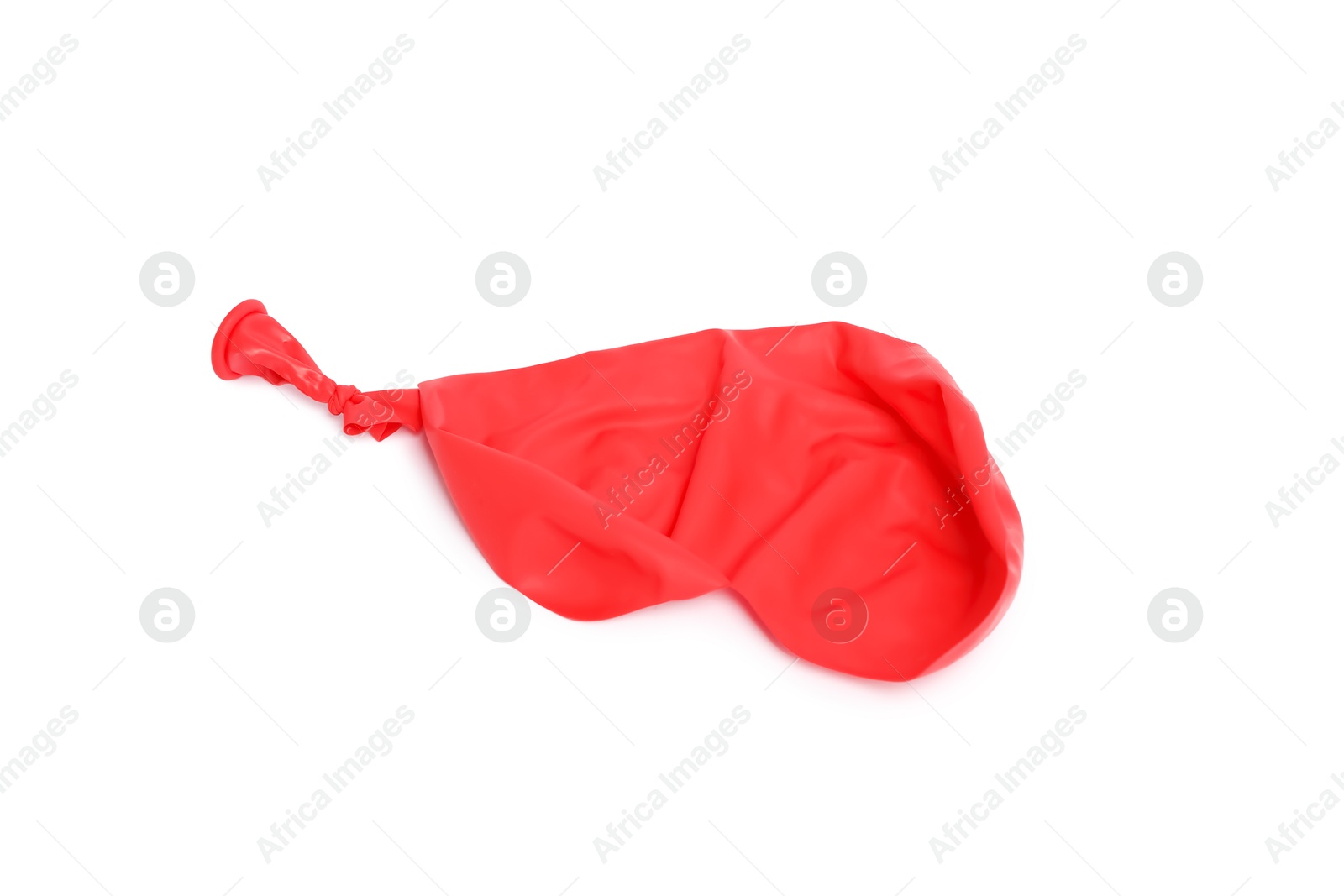 Photo of One red popped balloon isolated on white