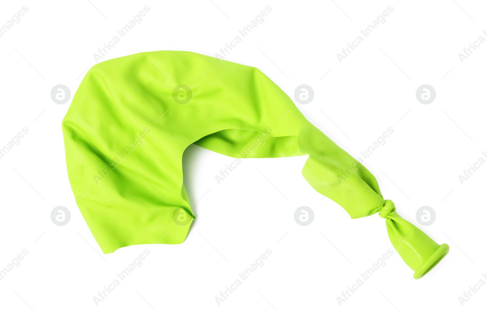 Photo of One green popped balloon isolated on white