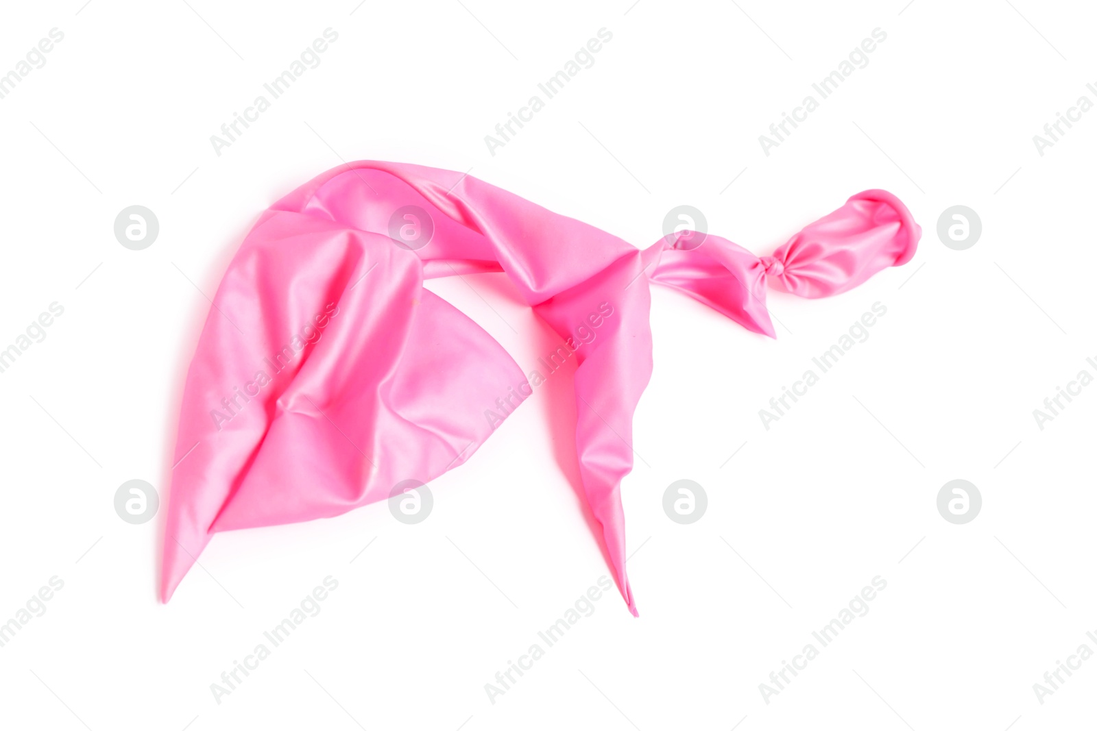 Photo of One pink popped balloon isolated on white, top view