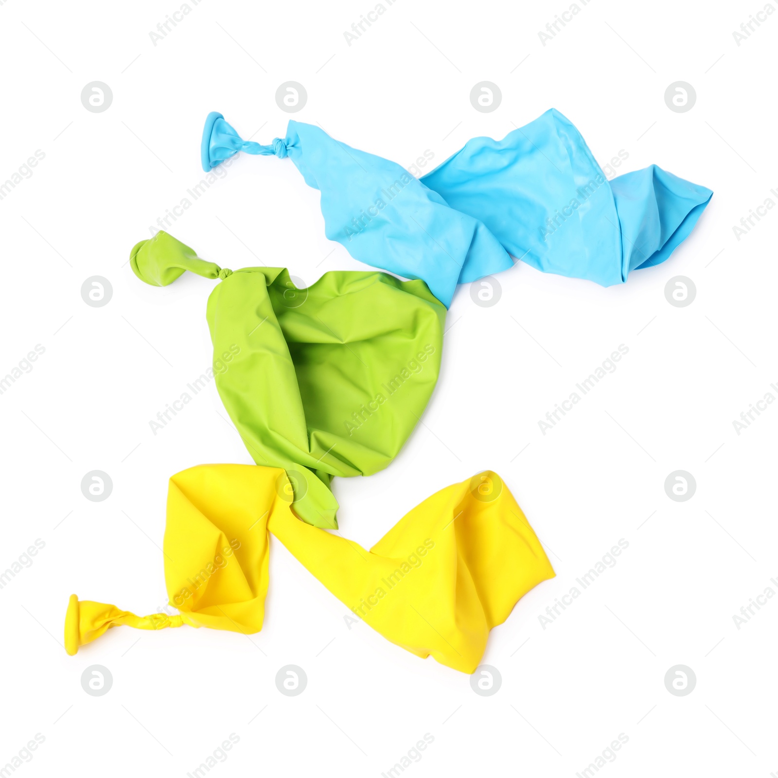 Photo of Three color popped balloons isolated on white