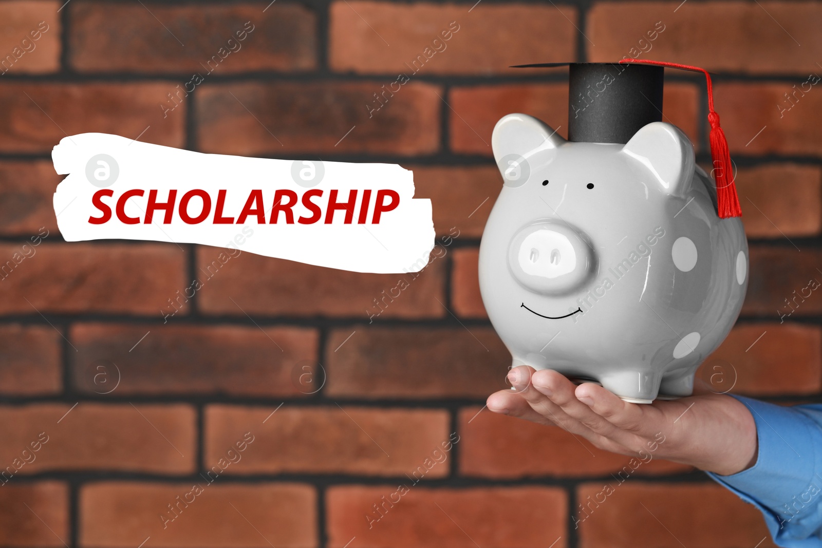 Image of Scholarship. Man holding piggy bank with graduate hat against brick background, closeup