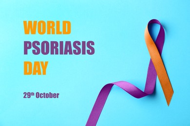 Image of World Psoriasis Day (October, 29). Orange-orchid awareness ribbon on light blue background, top view