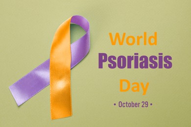 Image of World Psoriasis Day (October, 29). Orange-orchid awareness ribbon on olive color background, top view