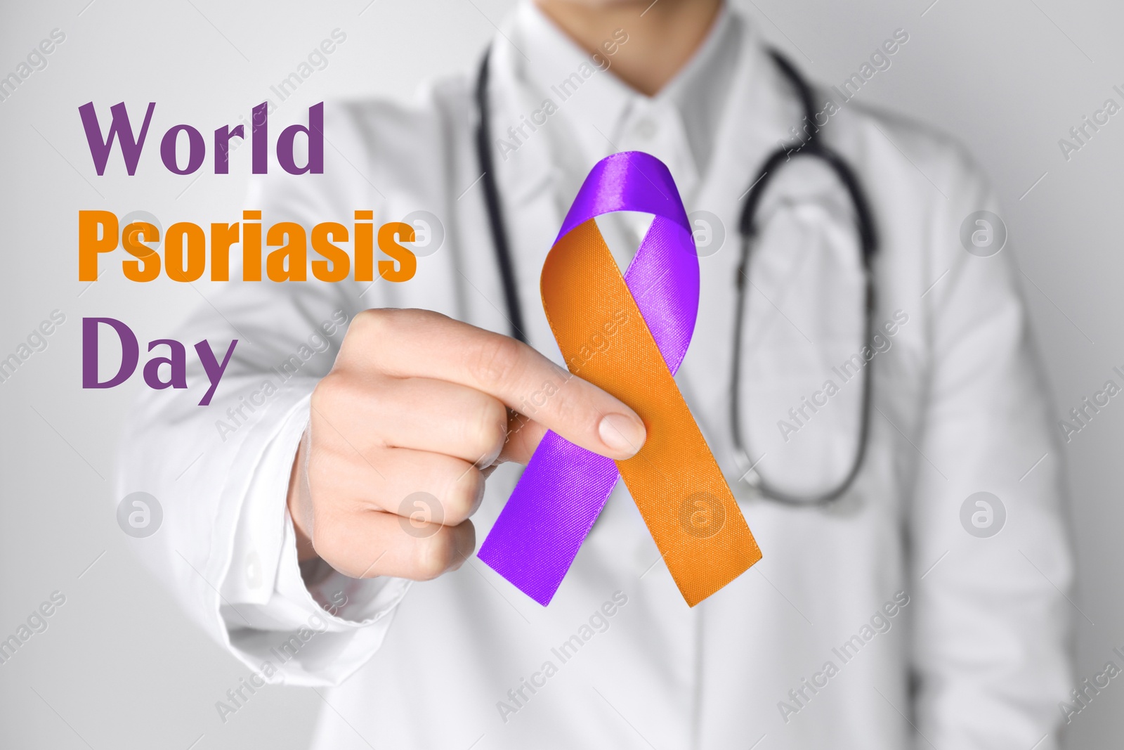 Image of World Psoriasis Day. Doctor holding orange-orchid awareness ribbon on white background, closeup