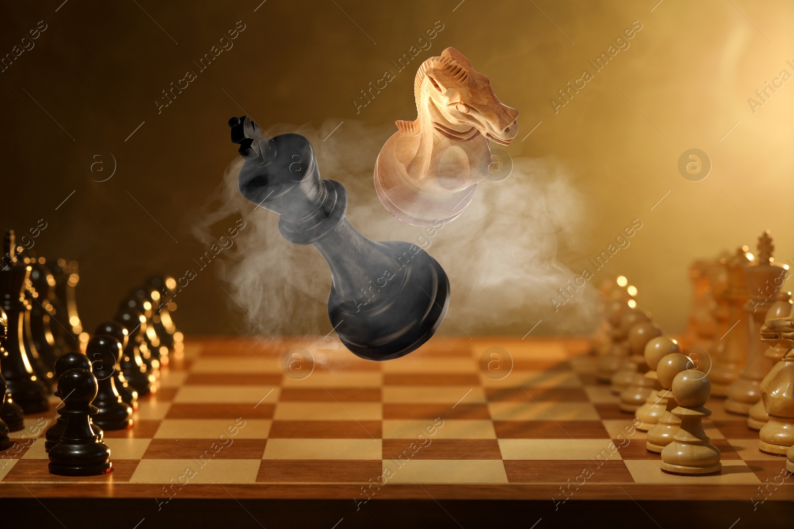 Image of Chess game. White knight and black king in air over chessboard