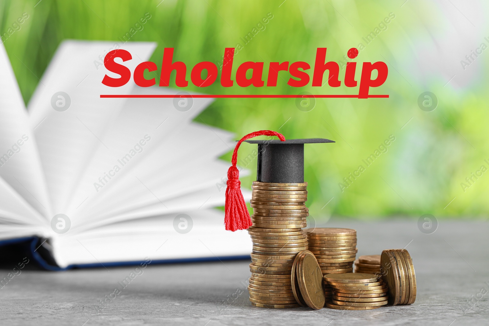 Image of Scholarship. Coins and graduate hat on grey table