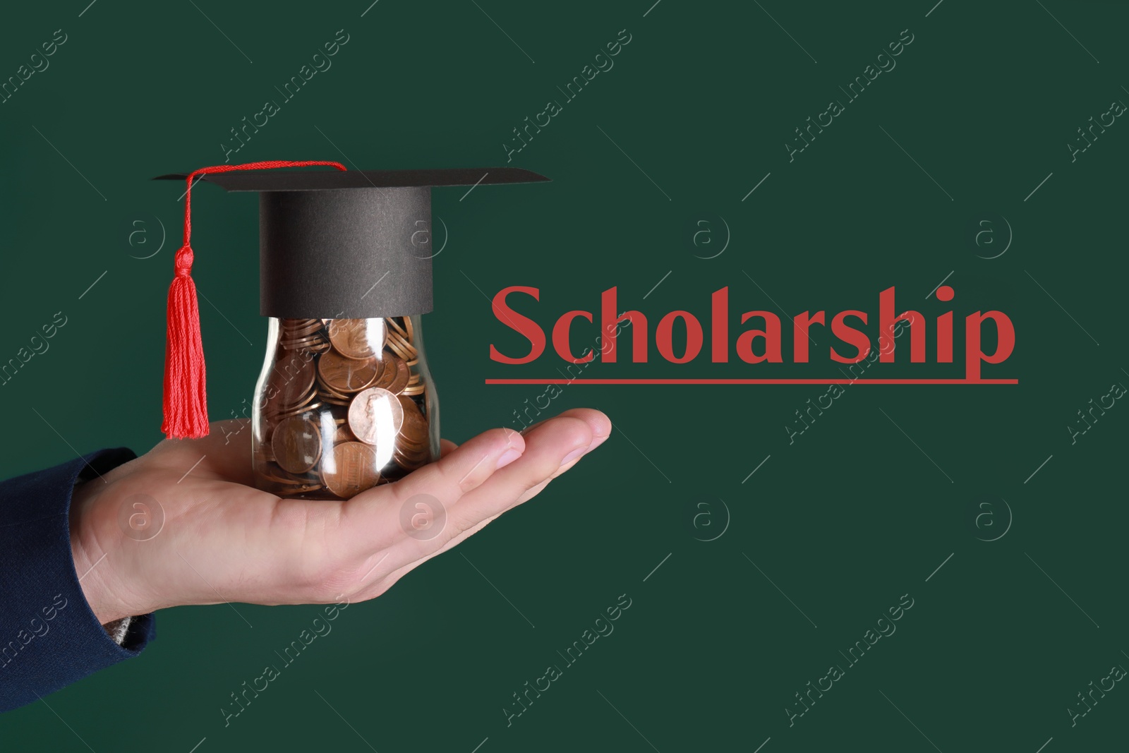 Image of Scholarship. Man holding glass jar of coins with graduate hat against dark green background, closeup