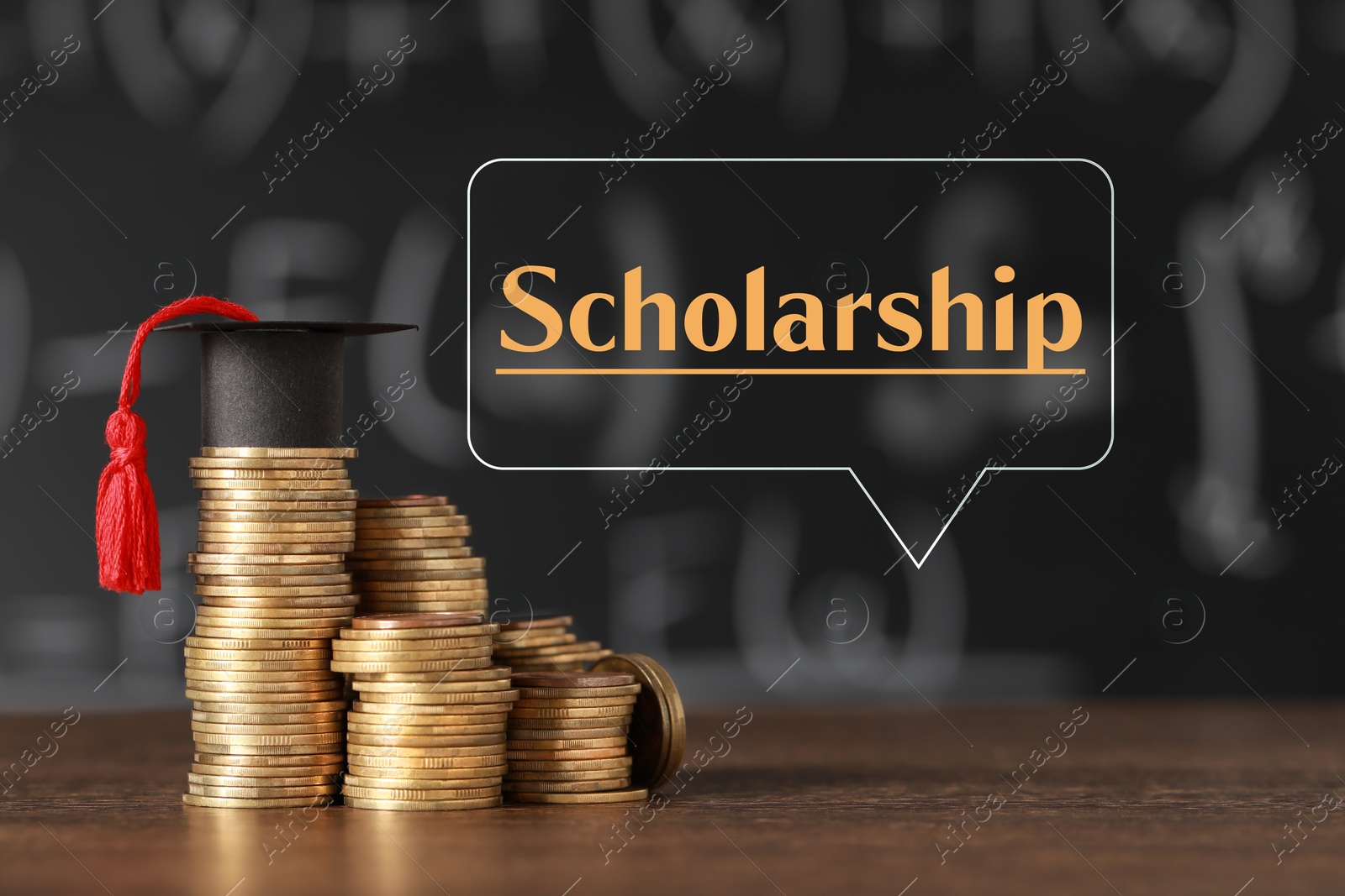 Image of Scholarship. Graduate hat and stacked coins on wooden table against chalkboard. Speech bubble with word