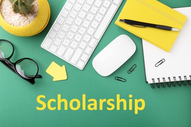 Image of Scholarship. Flat lay composition with different office stationery on green table