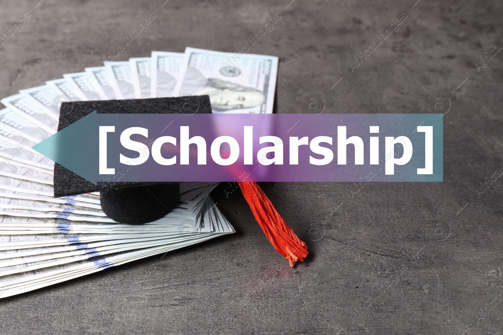 Image of Scholarship. Graduate hat and dollar banknotes on grey table