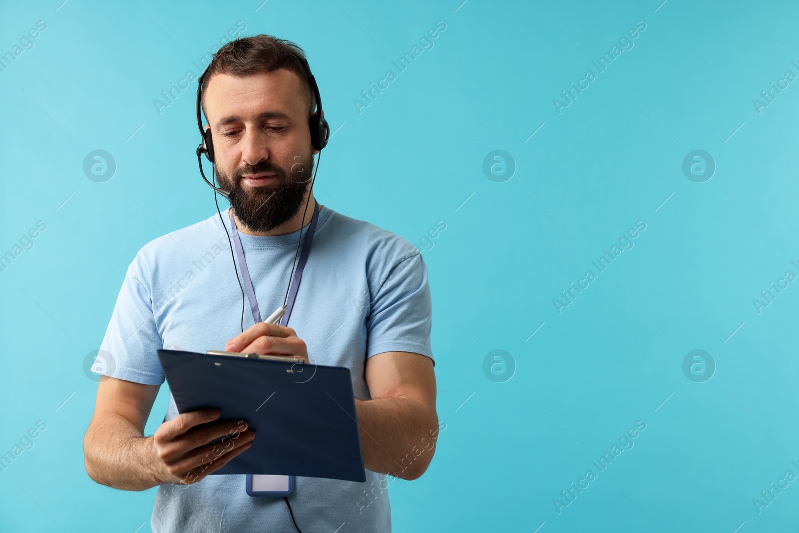 Photo of Technical support call center. Operator with clipboard on light blue background. Space for text