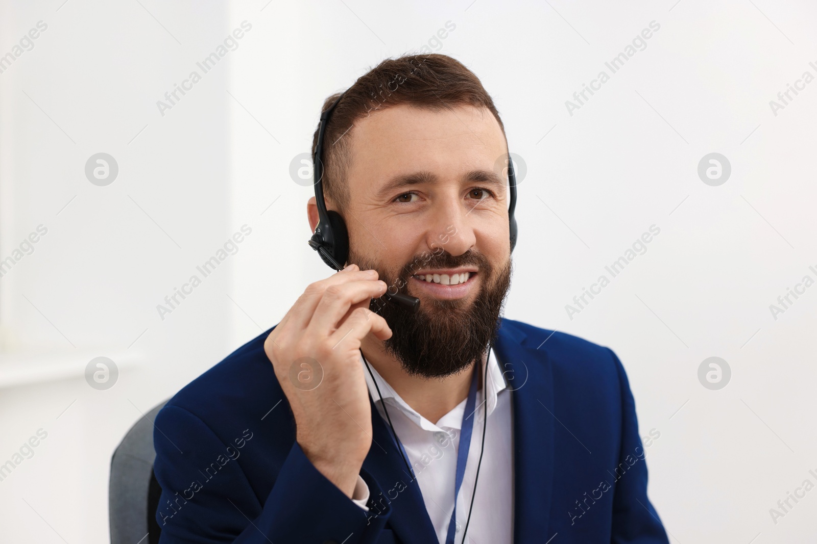 Photo of Technical support call center. Portrait of smiling operator in office