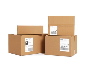 Photo of Many parcels with shipment labels isolated on white