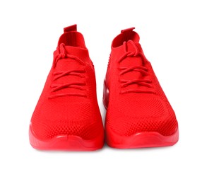 Photo of Pair of red sneakers isolated on white. Sportive shoes