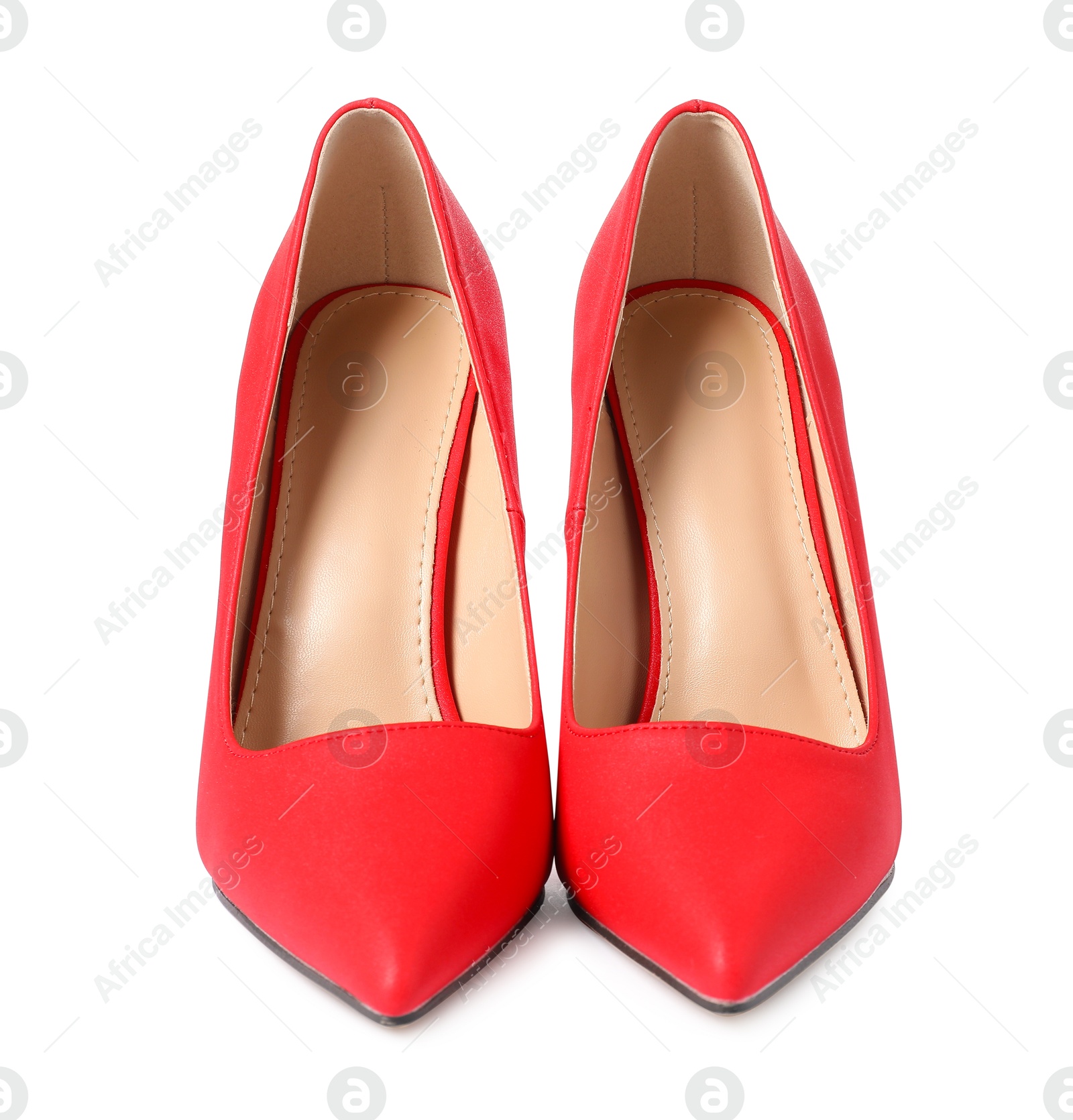 Photo of Beautiful red high heeled shoes isolated on white