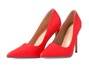 Photo of Beautiful red high heeled shoes isolated on white