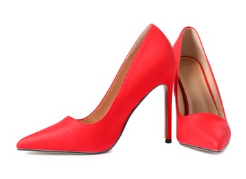 Photo of Beautiful red high heeled shoes isolated on white