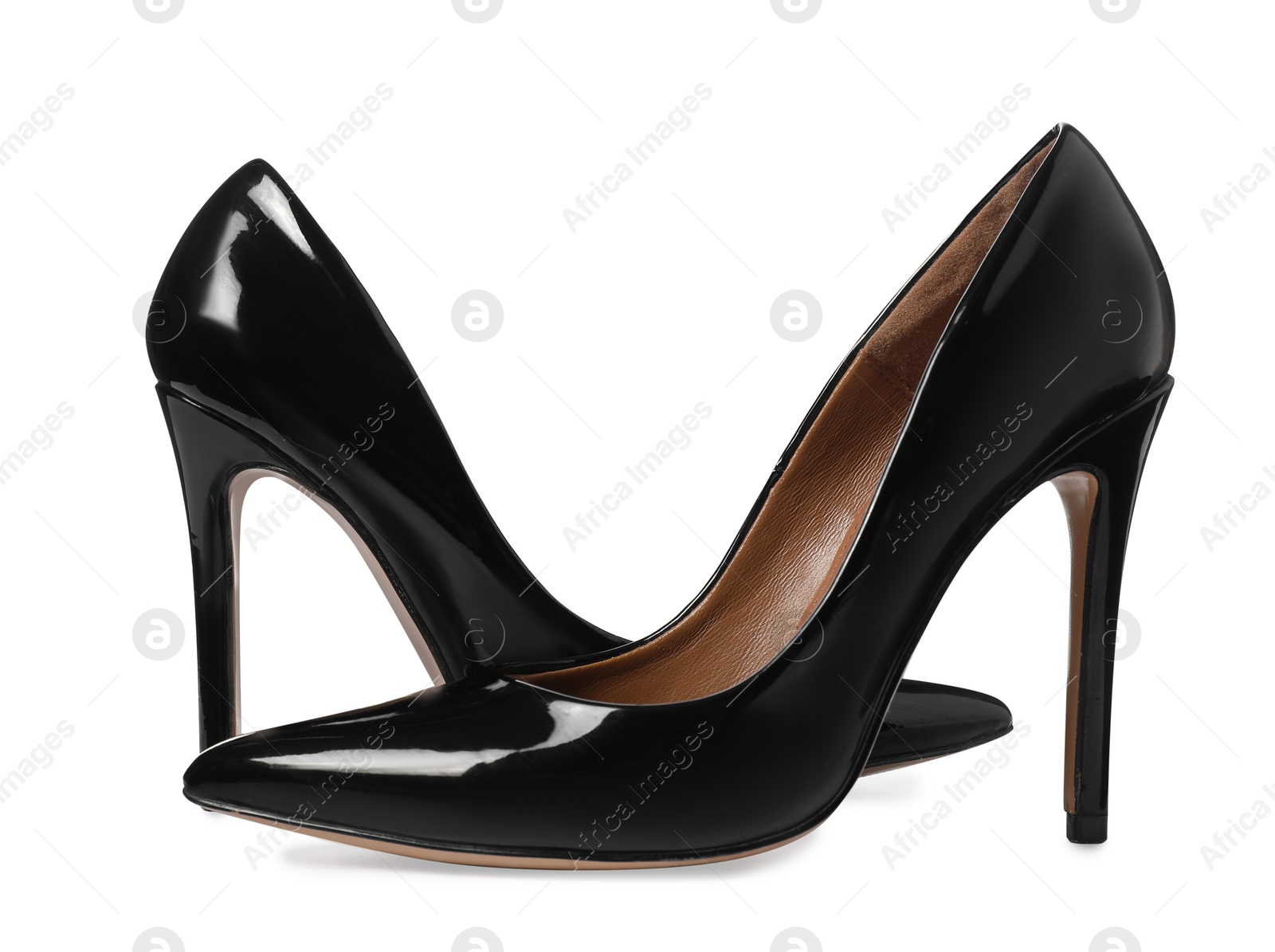 Photo of Beautiful black high heeled shoes isolated on white