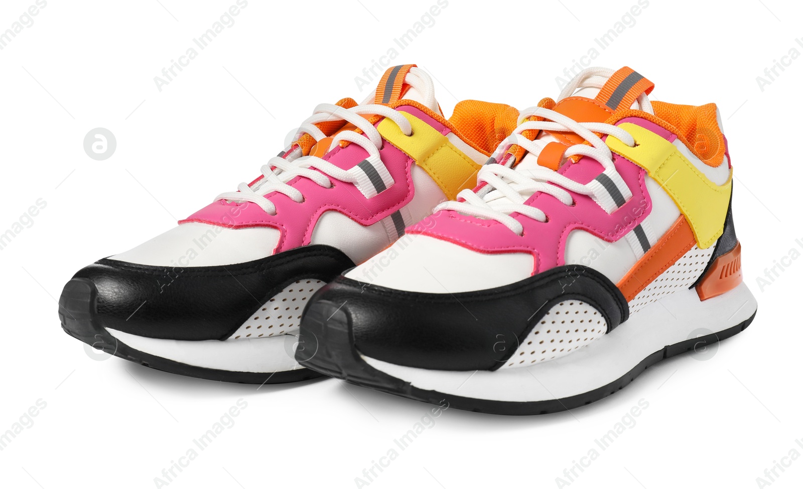 Photo of Pair of colorful sneakers isolated on white. Sportive shoes