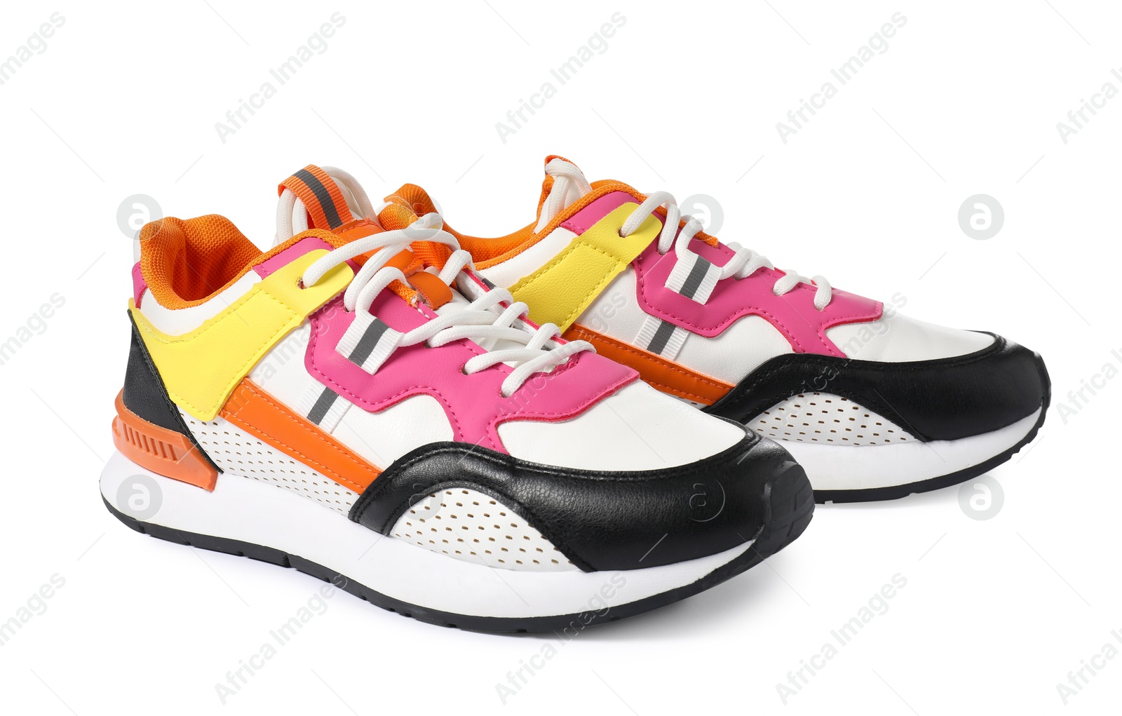 Photo of Pair of colorful sneakers isolated on white. Sportive shoes