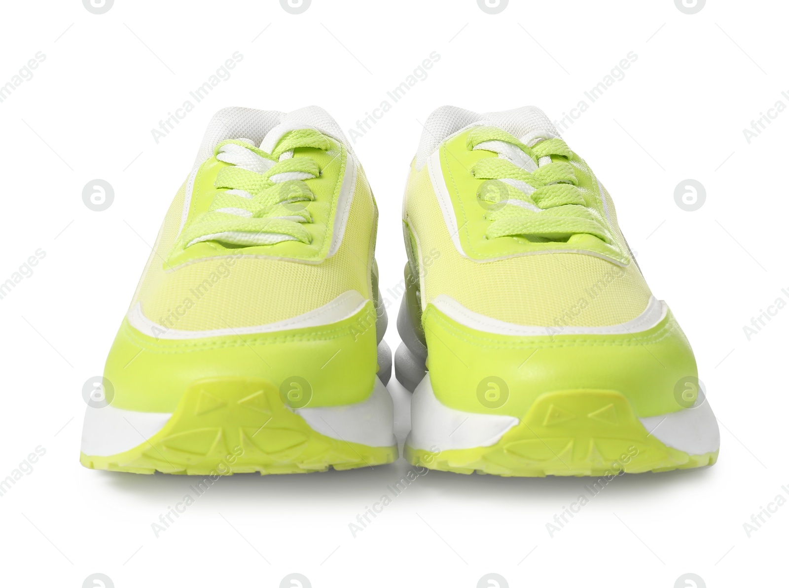 Photo of Pair of green sneakers isolated on white. Sportive shoes