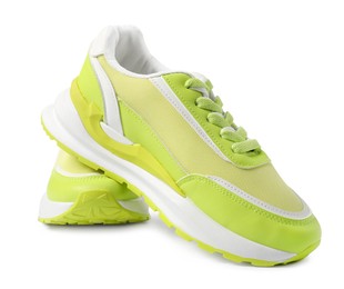 Photo of Pair of green sneakers isolated on white. Sportive shoes