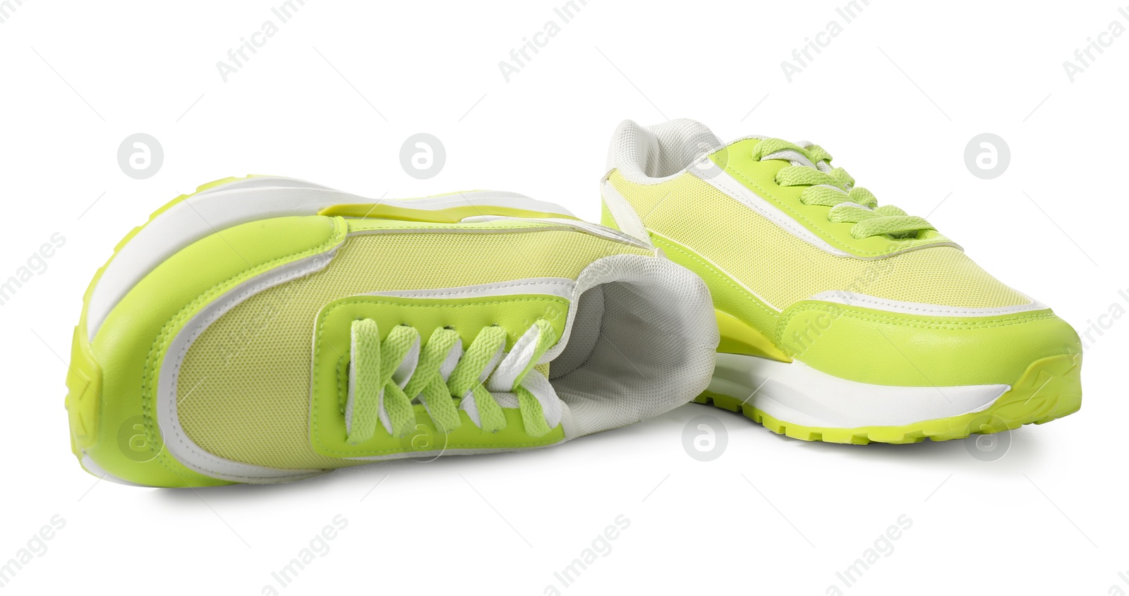 Photo of Pair of green sneakers isolated on white. Sportive shoes