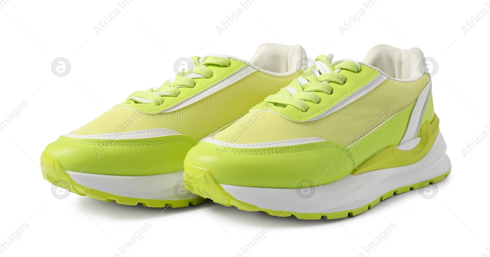 Photo of Pair of green sneakers isolated on white. Sportive shoes