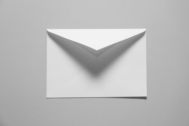 Paper envelope on gray background, top view. Mockup for design