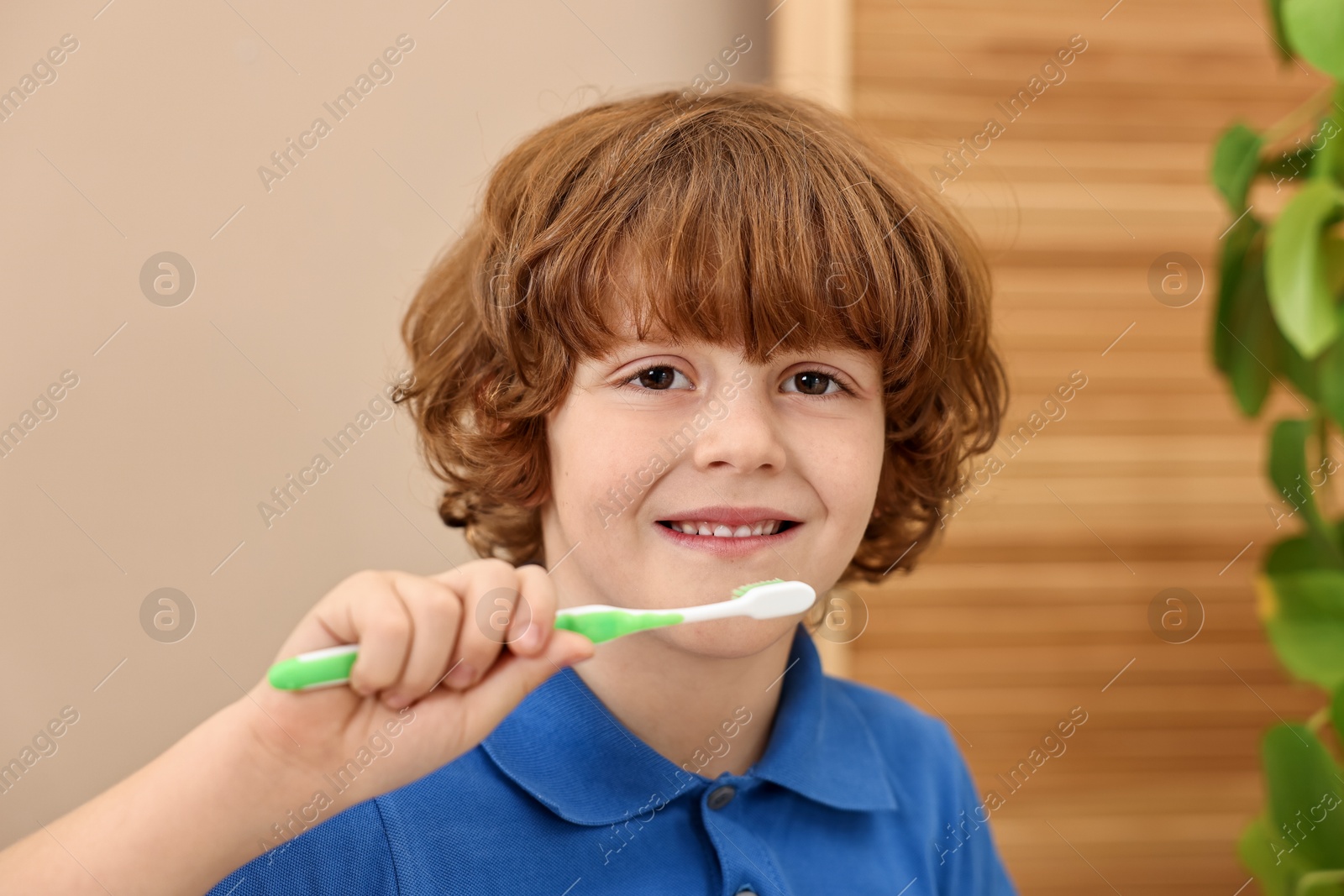 Photo of Cute boy with toothbrush at home. Personal hygiene