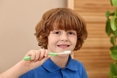 Photo of Cute boy with toothbrush at home. Personal hygiene