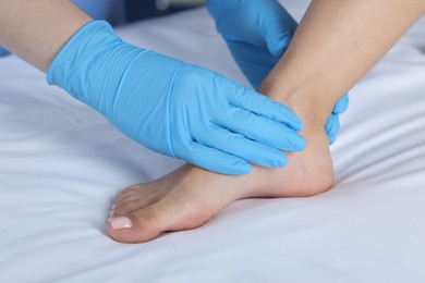 Photo of Doctor examining patient's foot in hospital, closeup