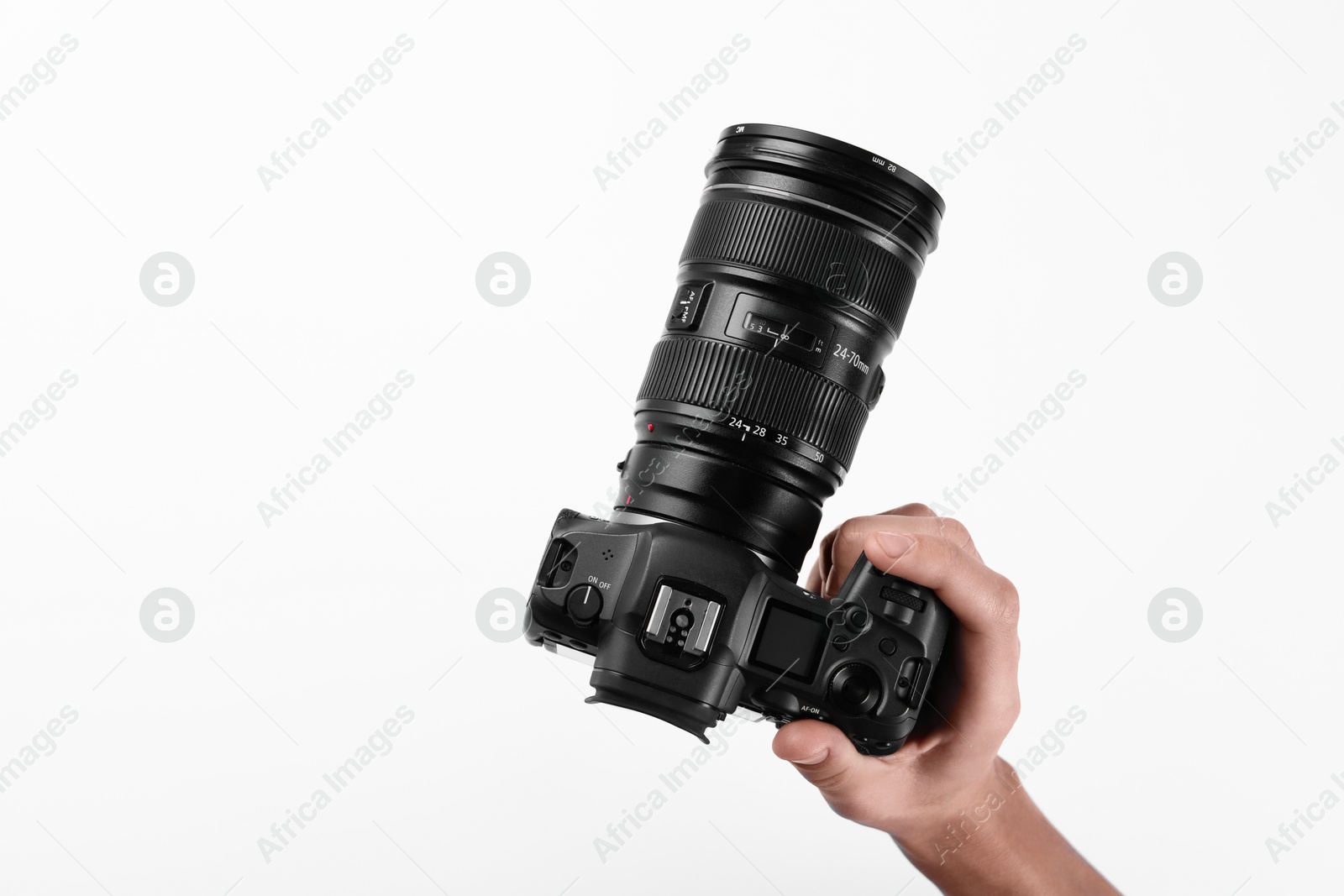 Photo of Photographer with professional camera on white background, top view. Space for text