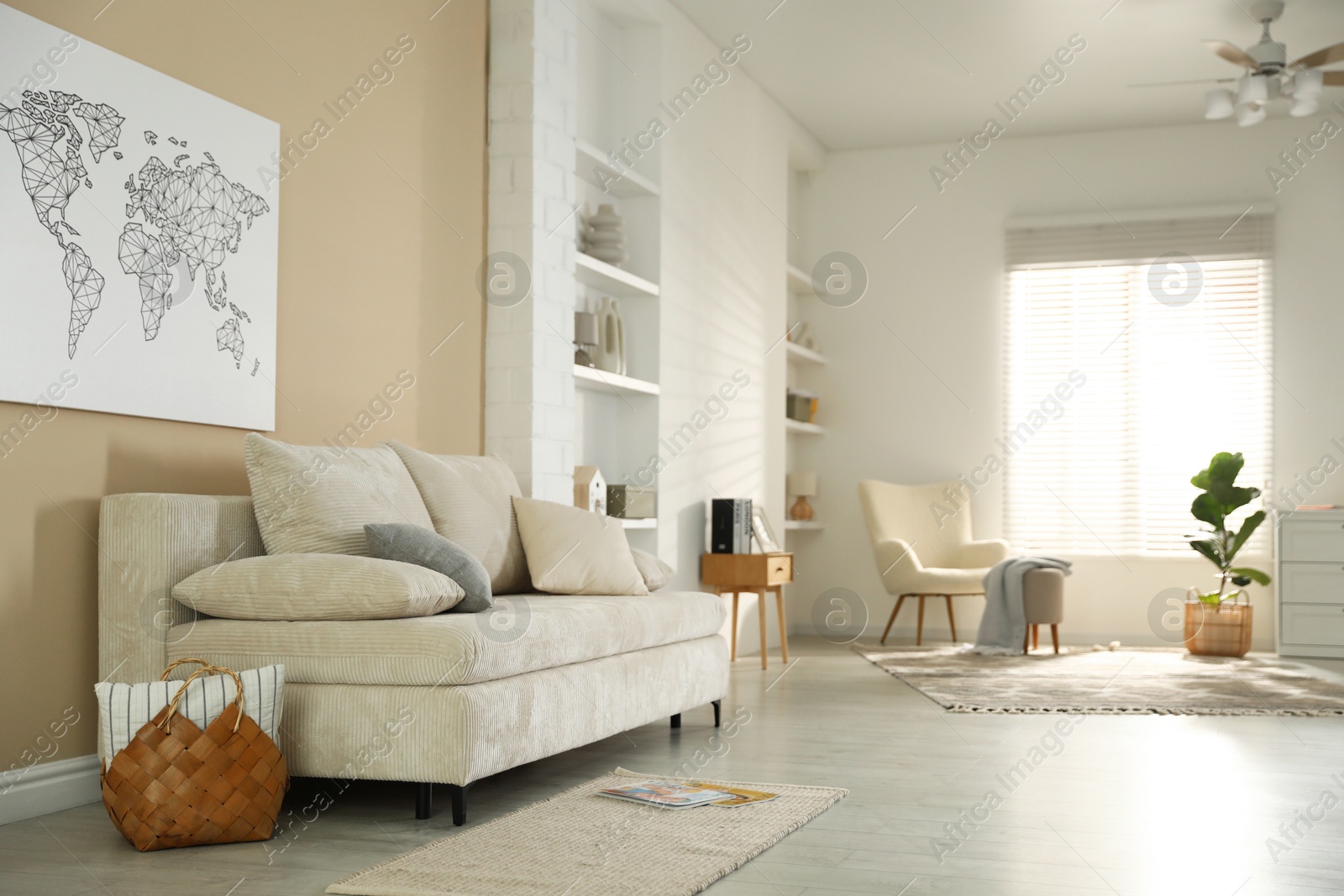 Photo of Comfortable sofa with pillows in living room