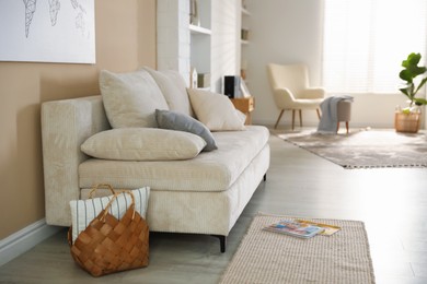 Photo of Comfortable sofa with pillows in living room